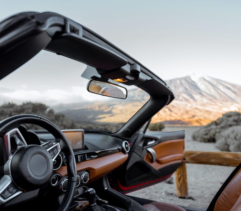 convertiblle-sports-car-on-the-mountain-roadside-2023-11-27-05-26-19-utc-scaled