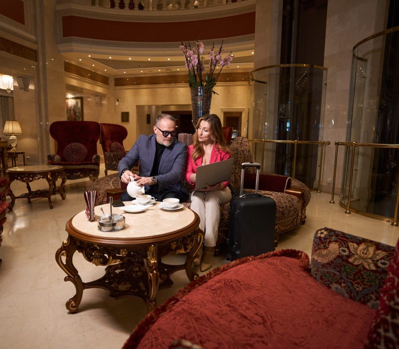 man-and-woman-with-laptop-communicate-in-cozy-rela-2023-11-27-04-59-47-utc-scaled